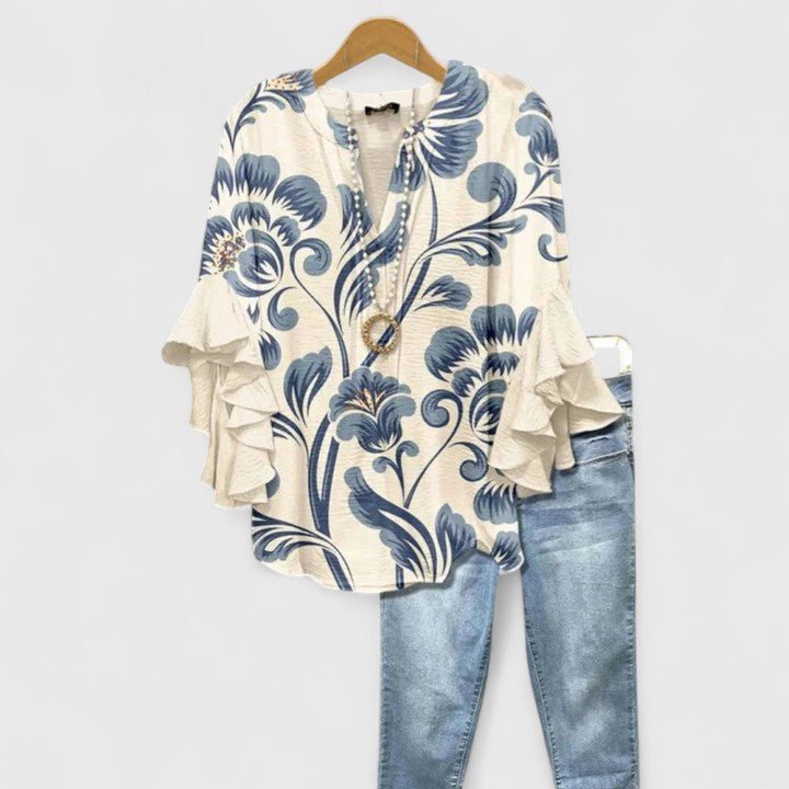 Women's blouse featuring an elegant floral print and stylish ruffled sleeves, designed for breathability and versatility in various settings. 0